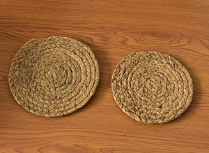 Detail of natural handmade woven round heat-resistant coasters for plates and pots