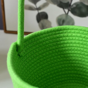 Macro detail of vibrant green woven storage basket with sturdy reinforced handle stitching