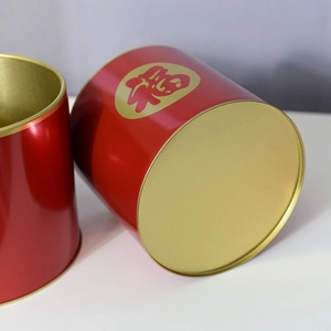 Detail of red metal floral buckets featuring gold Fu character and festive matte finish