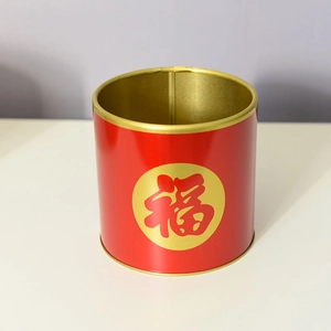 Detail of red festive iron floral bucket with gold Fu character and metallic interior