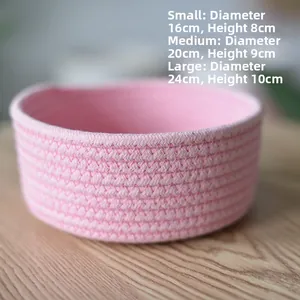 Close-up of pink woven cotton rope storage basket texture and fine stitching detail