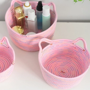 Pink cotton rope storage basket with cute cat ear handles for desktop organization