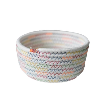 White cotton rope storage basket with colorful wavy stitching for home organization
