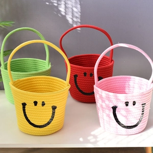 Close-up of colorful cotton rope baskets with smiley faces and convenient handles