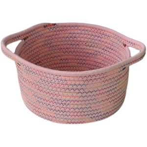 Pink woven cotton rope storage basket with colorful zigzag stitching and dual handles