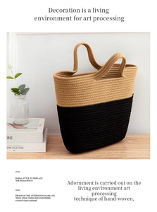 Detail of handmade two-tone straw tote bag with black contrast and woven texture