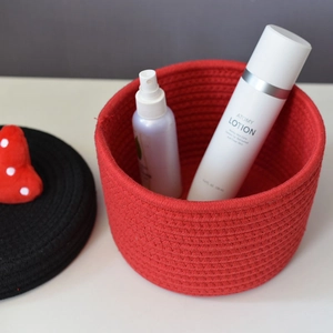 Cotton rope storage basket with red weave and black lid featuring a red heart decoration