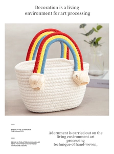 Close-up of handmade cream cotton rope bag with vibrant rainbow wrapped handle and tassels
