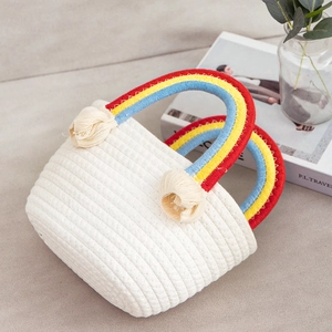 Handmade white cotton rope bag with rainbow handles and tassels for summer beach trips
