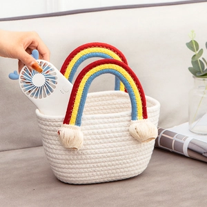 Handmade cream cotton rope woven basket bag with rainbow handle and decorative tassels