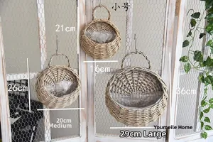 Three sizes of woven wicker wall baskets with liners for hanging plant display