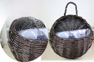 Detail of handmade brown woven wicker flower basket with waterproof plastic lining