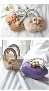 Close-up of cotton rope handbag featuring a rainbow handle and 3D floral accents