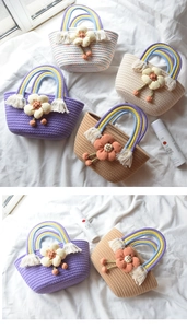 Close-up of handmade woven cotton rope handbag with 3D flower decor and rainbow handle