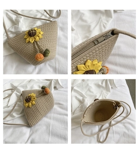 Detail view of woven straw shoulder bag with sunflower decor and metallic zipper closure