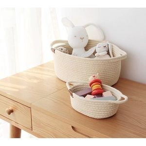 Nordic cotton rope storage baskets set of 2 with brown leather handles on wooden table