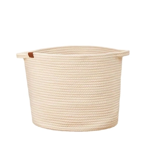 Minimalist Nordic cotton rope storage basket with woven handles and leather tag in off-white