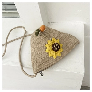 Detailed texture of straw woven triangle bag with sunflower patch and colorful beads