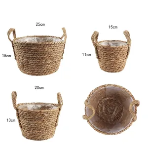 Set of 3 woven straw plant baskets with handles and waterproof liners in various sizes