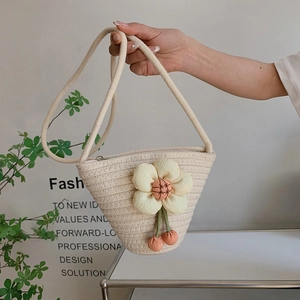 Mini cotton woven bucket bag with yellow flower and cherry charms for summer beach holidays