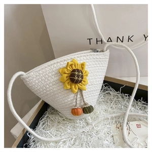 Close-up of white woven triangle bag with 3D sunflower and colorful bead charms