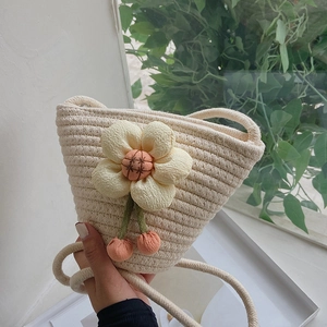 Mini cotton woven bucket bag with yellow flower and cherry charms for summer beach holidays