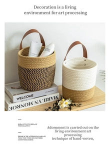 Detail of woven desktop storage baskets with leather handles and metal rivet reinforcement