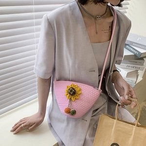 Pink straw woven crossbody bag with 3D sunflower decor for beach and summer vacations