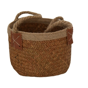 Handwoven seagrass storage basket with jute rope handles and faux leather accents