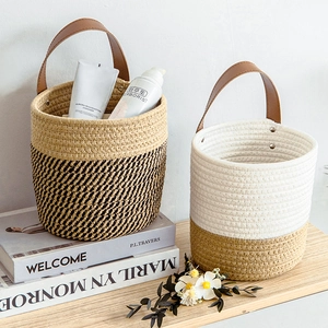 Set of 2 woven cotton rope storage baskets with leather handles in Nordic minimalist style
