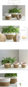 Detailed view of woven seagrass plant basket with cotton rope stitching and waterproof liner