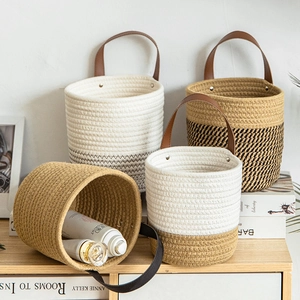 Set of Nordic cotton rope woven hanging storage baskets with leather handles in varied colors