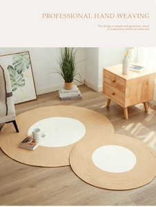 Close-up of Nordic handwoven cotton round rug set on light wood floor with natural textures