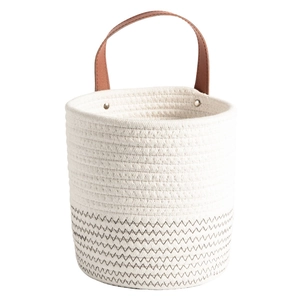 Minimalist cotton rope woven storage basket in cream with black zigzag pattern and leather handle