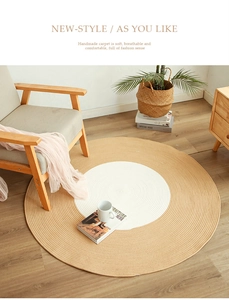 Detail of a Nordic round woven cotton rug featuring a two-tone spiral braided pattern