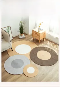 Detailed view of Nordic cotton woven round rug showing close-up spiral texture on wood floor