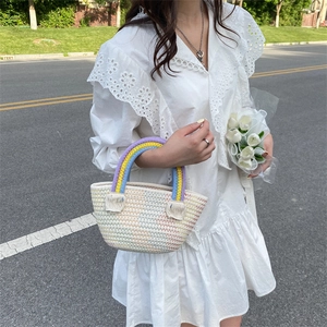 Handmade rainbow crochet tote bag with colorful handles and summer woven texture