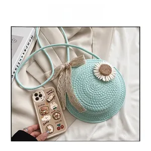 Detailed macro view of mint green straw bag with white daisy and lace bow accent