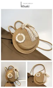 Detailed macro view of khaki straw bag featuring a white daisy and lace bow decoration