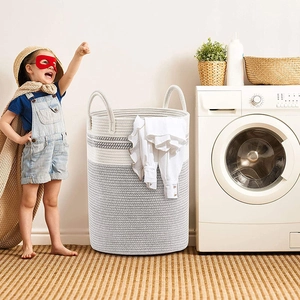Large woven cotton rope laundry basket with two-tone grey and white design and handles