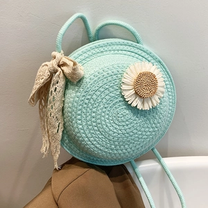 Mint green round straw woven bag with white daisy detail and lace bow for women