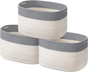 Detail of woven cotton rope storage baskets with dual-tone grey and cream stitched design