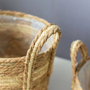 Close-up of handwoven wicker basket handle with a waterproof plastic liner detail