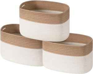 Detail of woven cotton rope baskets with dual-tone design and built-in side handles