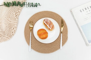 Macro detail of natural jute braided placemat with tight spiral heat-resistant texture