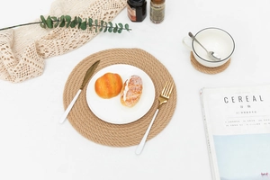 Macro shot of circular handwoven jute placemats with heat insulation for home dining tables