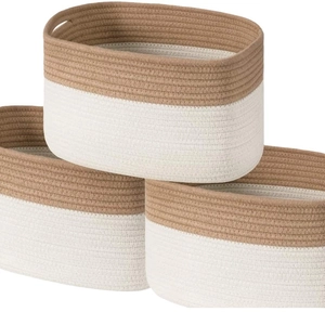 Three-piece nesting cotton rope storage baskets in beige and brown with oval dual handles