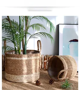 Close-up of woven straw plant pot with white stripes and waterproof plastic liner
