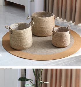 Three-piece woven straw planter set with waterproof liners and leather side handles