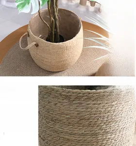 Macro view of hand-woven natural seagrass texture and sturdy handles of the round planter